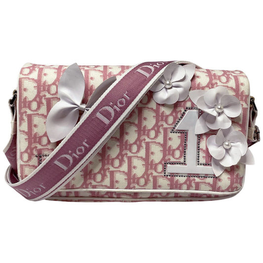 Christian Dior pink monogram canvas girly flap bag by John Galliano for Dior 2004 with pearl center white flowers, white patent piping, Swarovski crystal No 1 and Dior crystal logo. Pink with white edged satin canvas adjustable shoulder strap. Pink textile interior, one interior pocket. Made in Italy 