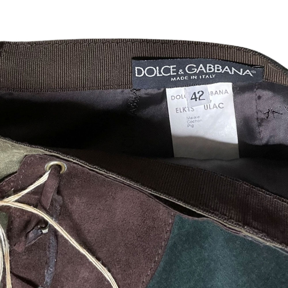 FW 2002 patchwork A-line red, turquoise, olive and tan suede skirt with slight rise in front hemline, lacing at front waist, silk jacquard logo lining, invisible back zipper. Made in Italy 