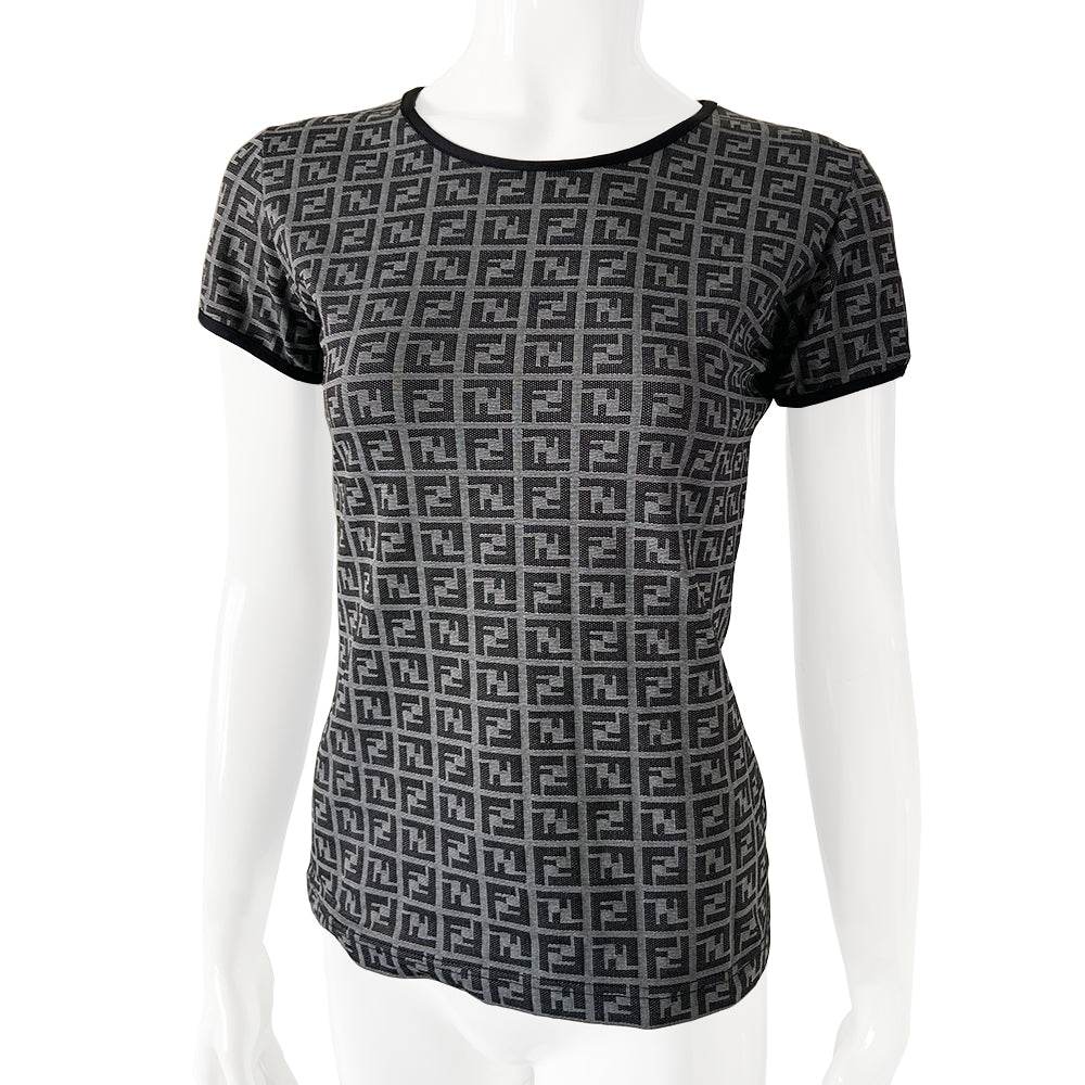 Fendi Zucca print short sleeve tee with all over Fendi FF Zucca logo print with solid black neck and sleeve trim in grey with black print/. Tag Size: 44. Made in Italy 