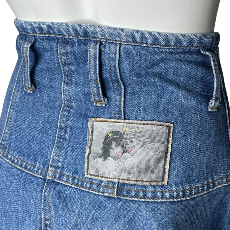 Fiorucci circa 90's high waisted flared light blue denim skirt with belt loops, front pockets with rivets, zip fly front closure with metal engraved logo button at top Fiorucci angel logo patch at back waist.
