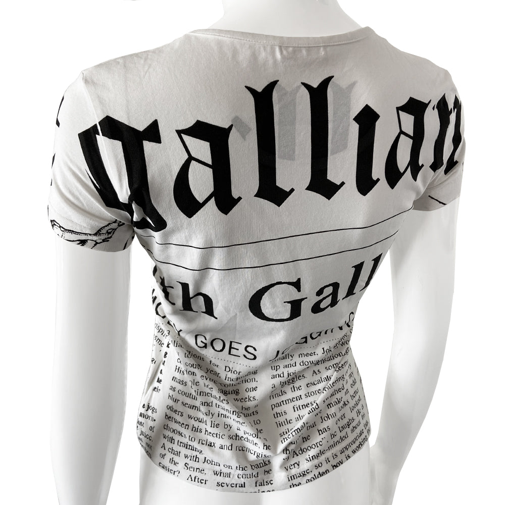 John Galliano Gazette Newsprint tee with signature Galliano gazette newsprint design in white with black print. Unisex style with short sleeves and rounded neckline. Size small in excellent condition, interior hologram authenticity tag attached.  Made in italy. 