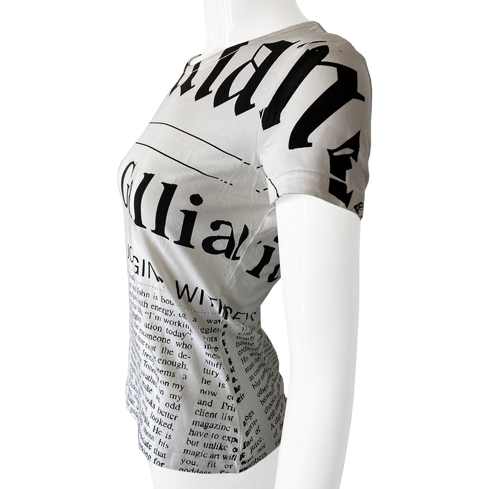 John Galliano Gazette Newsprint tee with signature Galliano gazette newsprint design in white with black print. Unisex style with short sleeves and rounded neckline. Size small in excellent condition, interior hologram authenticity tag attached.  Made in italy. 