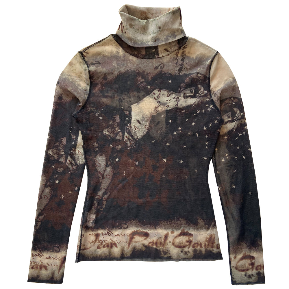 Jean Paul Gaultier brown, beige, burgundy long sleeve mesh turtleneck by Jean Paul Gaultier Femme, AW 2003 featuring reclining semi nude woman, floating stars and Jean Paul Gaultier signature on front, back and sleeves, black serged accent seams. Made in Japan 