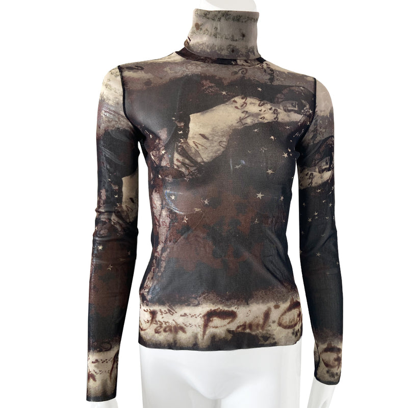 Jean Paul Gaultier brown, beige, burgundy long sleeve mesh turtleneck by Jean Paul Gaultier Femme, AW 2003 featuring reclining semi nude woman, floating stars and Jean Paul Gaultier signature on front, back and sleeves, black serged accent seams. Made in Japan 