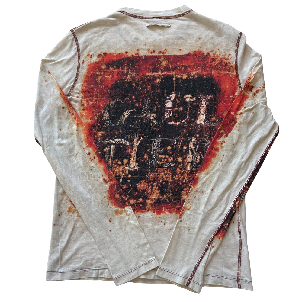 Jean Paul Gaultier Homme long sleeve tee circa 1990’s with crew neck and red contrast stitched seams. GAULTIER spelled out in depictions of snakes, lizards and arms on front, back and on sleeves with printed red splatter marks throughout. Tag size: M Main Color: White with red and black. Made in Japan 