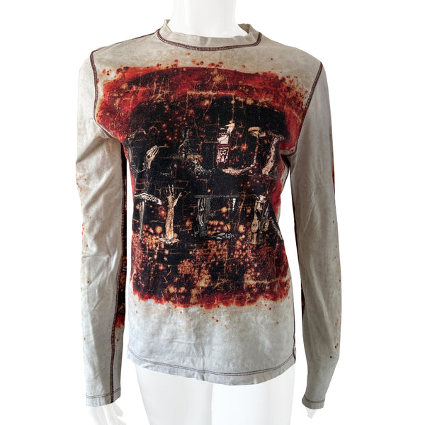 Jean Paul Gaultier Homme long sleeve tee circa 1990’s with crew neck and red contrast stitched seams. GAULTIER spelled out in depictions of snakes, lizards and arms on front, back and on sleeves with printed red splatter marks throughout. Tag size: M Main Color: White with red and black. Made in Japan 