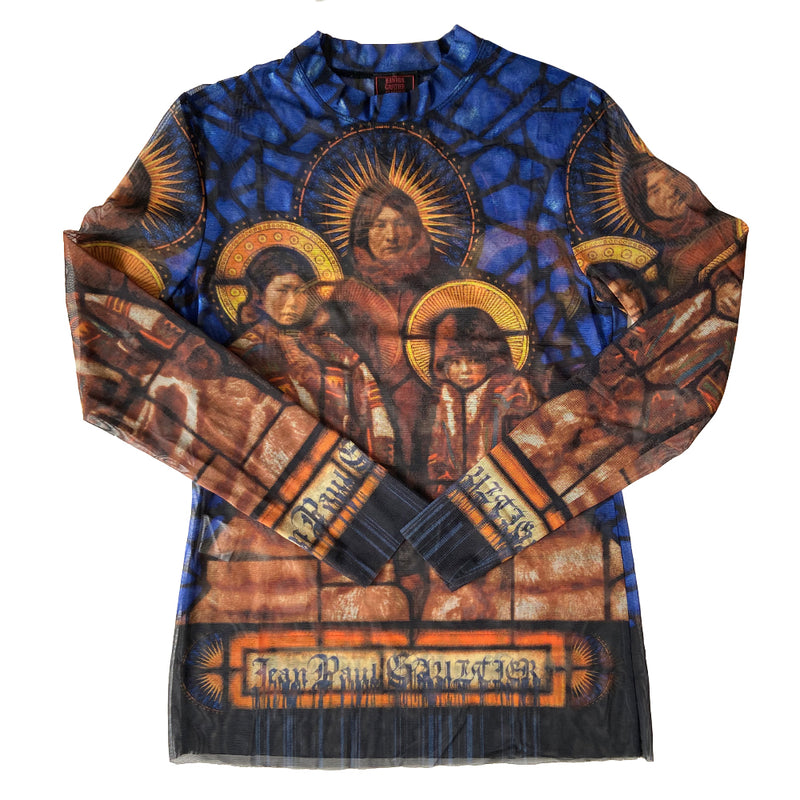 Jean Paul Gaultier stained glass saints mesh long sleeved top circa 1998 in blue, gold, tan. Front and back image a family of Saints on a background of stained glass with Jean Paul Gaultier printed along hemline and on sleeves. Tag size: 40. Made in Japan