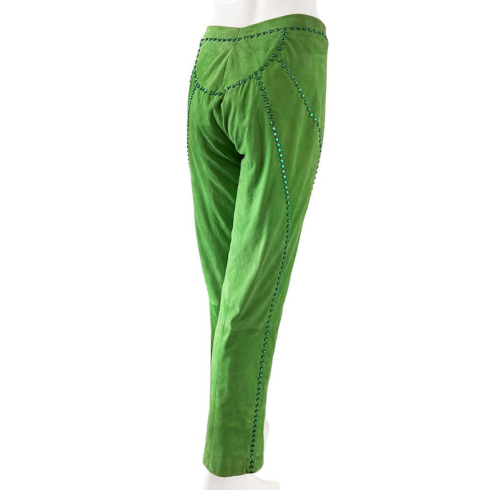 Very rare Gianni Versace Swarovski Crystal Suede Pants, circa late 80's early 90’s. High waisted with straight leg with invisible zipper and top hook front closure. Hand stitched rows of emerald colored swarovski crystals decorate the back, front and waistband Fabric: 100% suede leather, Acetate/Rayon lining 