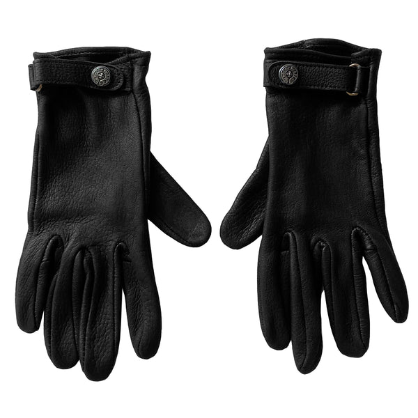 Chrome Hearts black size 7.5 leather gloves, circa mid 2000’s. Unlined with leather wrist strap and sterling silver logo snap button closure. Made in USA 