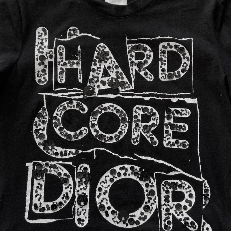 Christian Dior Hardcore Dior sequin embellished short sleeve crewneck tee Circa 2005 with sequin embellished print on front Size: 44 Color: Black with white print embellished with black sequins.