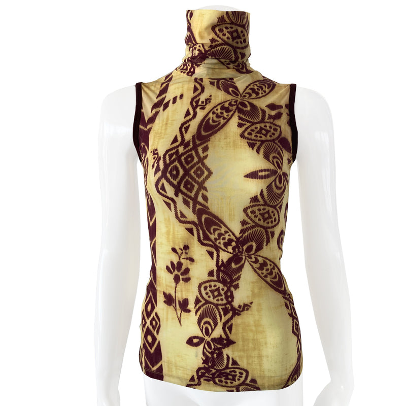 Polynesian print pastel yellow,burgundy mesh top by Jean Paul Gaultier, Jean Paul Gaultier label early 2000’s. Sleeveless, high neck tightly woven mesh fabric with Polynesian geometric and flower motifs, solid burgundy banded arm holes. Made in Japan 