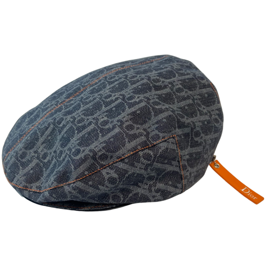 Christian Dior navy monogram flat cap by John Galliano for Dior, 2004 with orange contrast stitching, orange band, calf leather accent trim and orange rubber Dior logo hanging tag attached. Grosgrain interior ribbon and navy textile lining. Made in France