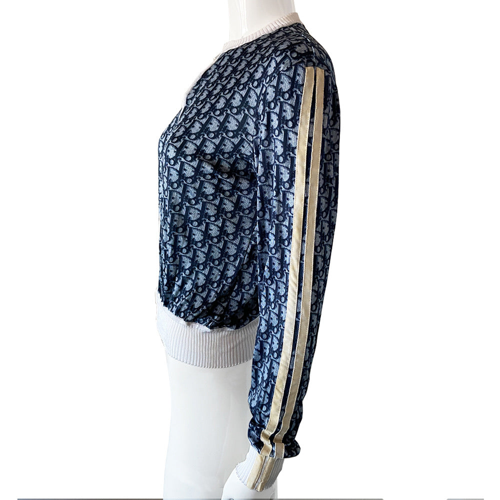 Christian Dior navy monogram on white zip jacket From 2002 by John Galliano for Dior. Long sleeved front zip Diorissimo print long sleeved with white accent ribbing at neckline and cuffs, 2 off-white stripes on each sleeve. Fabric: 100% Viscose Tag Size: FR 42. Made in France 
