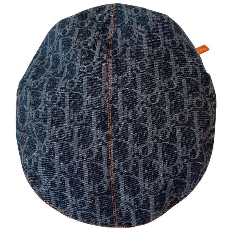 Christian Dior navy monogram flat cap by John Galliano for Dior, 2004 with orange contrast stitching, orange band, calf leather accent trim and orange rubber Dior logo hanging tag attached. Grosgrain interior ribbon and navy textile lining. Made in France