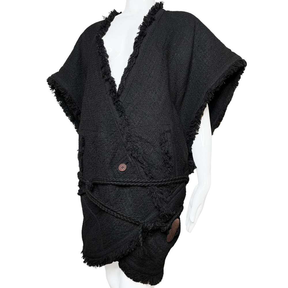  Fall 1984 Issey Miyake black fringed woven vest documented in Irving Penn's book, "Issey Miyake Photographs By Irving Penn", page 32 with back ornament detail featuring beads, sequins and embroidery with two side pockets, rope belt toggle tie, single front button. Style: NO ED67194. Made in Japan