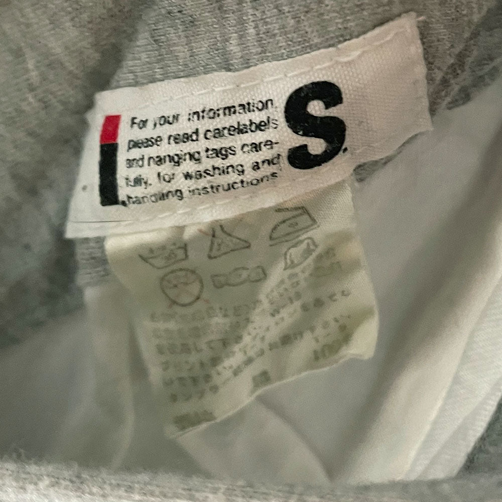 Issey Miyake by Tsumori Chisato navy zip hooded jacket with 2 front angled button flap pockets, ribbed cuffs and bottom hem, I.S. printed on back. Reversible with Interior lined in light grey jersey with two inner slip pockets. Made in Japan