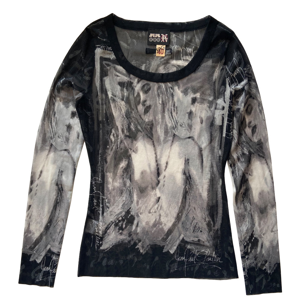 Jean Paul Gautier posing woman black and white long sleeve mesh top by Jean Paul Gaultier, JPG circa mid 90’s with posing woman graphic and Jean Paul Gaultier signature on front, back and sleeves Black banded scoop neck. Tage size: 40 Made in Japan