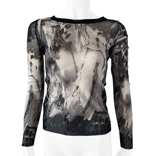 Jean Paul Gautier posing woman black and white long sleeve mesh top by Jean Paul Gaultier, JPG circa mid 90’s with posing woman graphic and Jean Paul Gaultier signature on front, back and sleeves Black banded scoop neck. Tage size: 40 Made in Japan