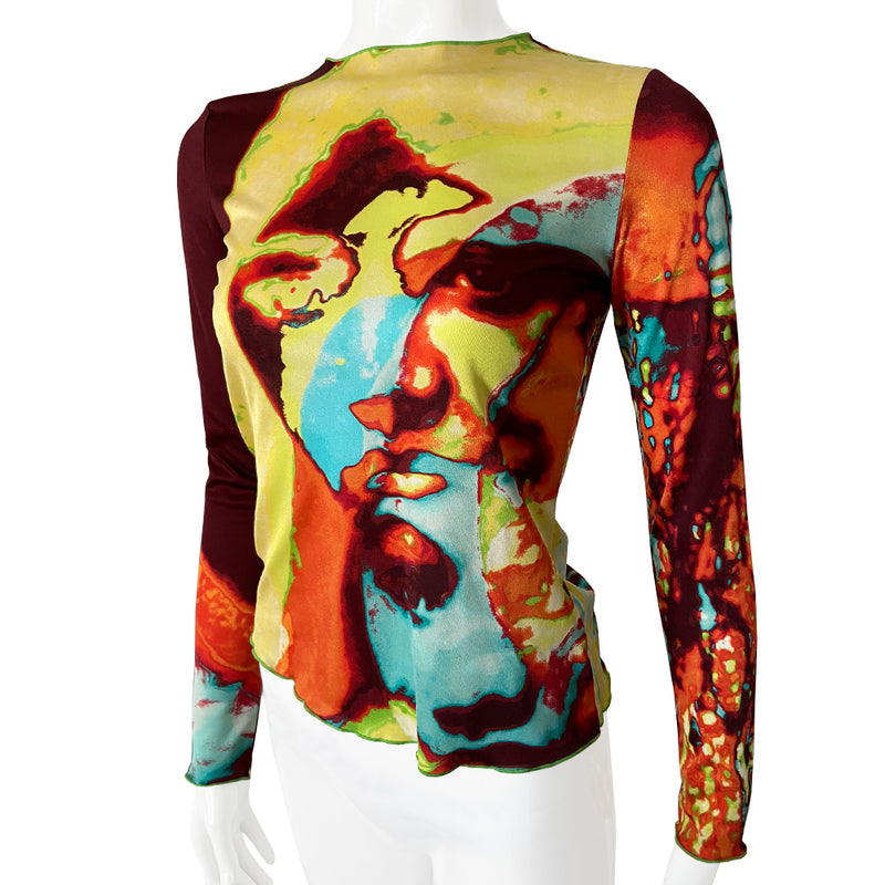 Jean Paul abstract faces long sleeve sheer mesh top by Jean Paul Gaultier Femme, spring 2000 featuring brilliant blue, lime green, orange, black faces and print in front, back and sleeves with lime green accent stitching. Tag size: 40. 100% Polyamide. Made in Japan 