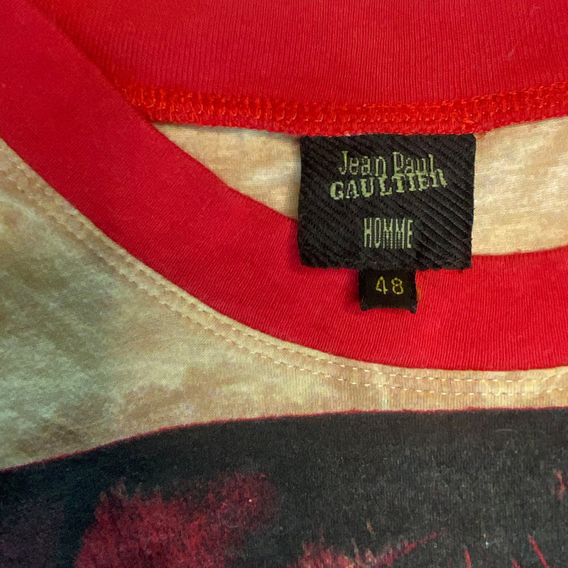 Jean Paul Gaultier Homme, circa 1994, short sleeve tee with contrast red crew neck and sleeve bands featuring a woman with tribal tattooed body. Size: 48 Made in Japan 