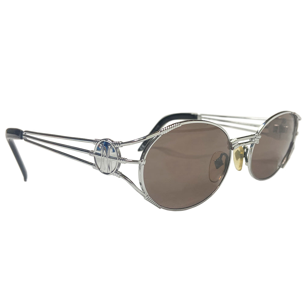 JPG oval lens 1990’s silver-tone metal frame sunglasses with brown lenses by Jean Paul Gaultier JPG with triple bar arms attached to plastic end piece and JPG logo at temples. 100% UV protection. Style: 58-5102 Made in Japan 