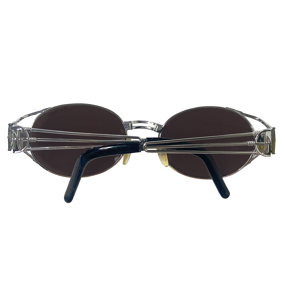 JPG oval lens 1990’s silver-tone metal frame sunglasses with brown lenses by Jean Paul Gaultier JPG with triple bar arms attached to plastic end piece and JPG logo at temples. 100% UV protection. Style: 58-5102 Made in Japan 