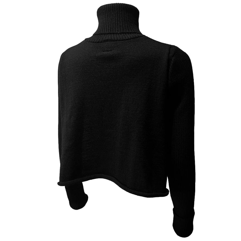 Jean Paul Gaultier cropped black wool turtleneck sweater circa 1990’s from JPG Paris label with with attached cape ribbed at neck and sleeve hems, JPG triangular logo at center chest. Made in Japan 