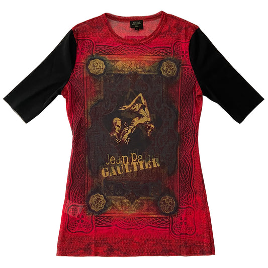 Jean Paul Gaultier tattoo artist 3/4 sleeve mesh top Jean Paul Gaultier Femme circa 1995 featuring Jean Paul Gaultier tattooing a woman’s arm on front and back. Tag size: 40 Main Colors: Red, black sleeves. Made in Japan 