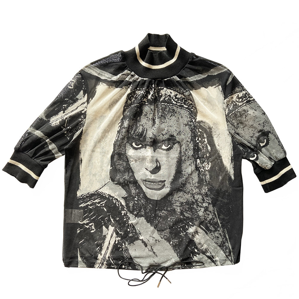 Jean Paul Gaultier 5th Element black and white mesh 3/4 sleeve top by Jean Paul Gaultier JPG 1997 with front and back portrait of Leeloo, knit mock collar and sleeve hems with white accent stripe. Elastic drawstring ties at bottom hemline. Made in Japan 