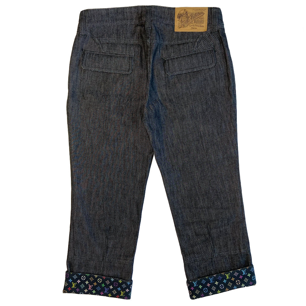 Louis Vuitton Multicolore Monogram crop jeans by Takashi Murakami for Louis Vuitton, mid 2000’s. Mid-rise 5 pocket blue/black denim with black multicolor monogram accents at front pockets, interior waist band, under rear flap pockets and at bottom fold-up cuffs. Made in Italy 