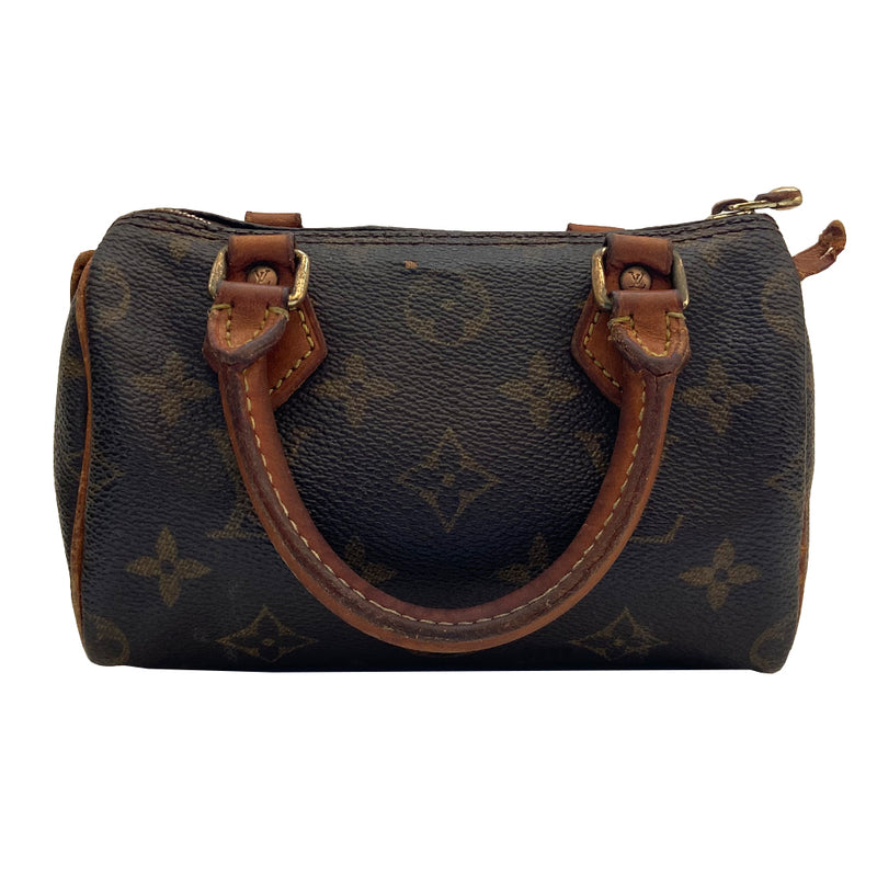 Louis Vuitton Monogram Nano Speedy bag from 1994 with vachetta leather rolled handles, piping and accent and gold-tone hardware. Top zip closure, canvas lining, interior date code is visible. Made in France 