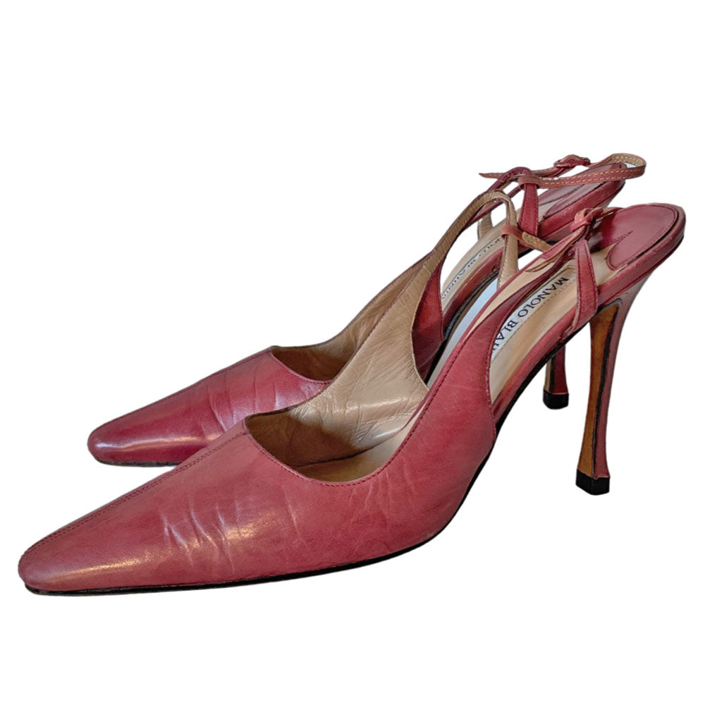 Manolo Blahnik pink leather slingback heels circa 90's with nude leather lining and adjustable 5 hole buckle closure. 