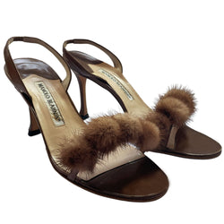 Manolo Blahnik bronze leather strappy heels with 4 mink pom-pom embellishments across the toe strap, slip-on elastic heel strap, open toe. Made in Italy 