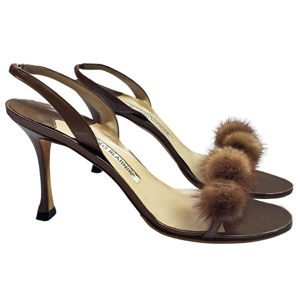 Manolo Blahnik bronze leather strappy heels with 4 mink pom-pom embellishments across the toe strap, slip-on elastic heel strap, open toe. Made in Italy 