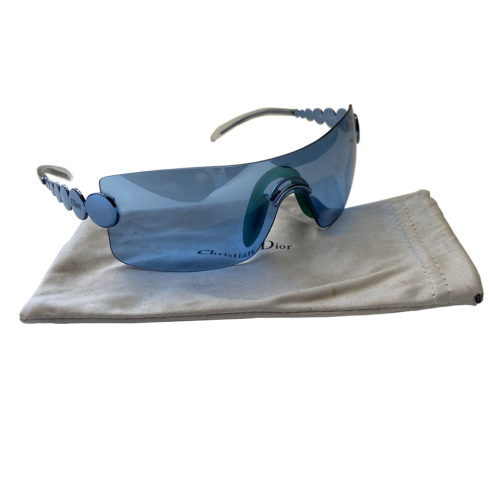 Christian Dior Millennium sunglasses from 2001. Oversized shield lens with silver-tone hardware Dior logo engraved on arms. Navy lens color with teal nose piece includes Dior pouch. 