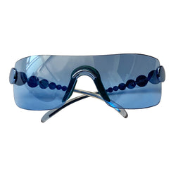 Christian Dior Millennium sunglasses from 2001. Oversized shield lens with silver-tone hardware Dior logo engraved on arms. Navy lens color with teal nose piece includes Dior pouch. 