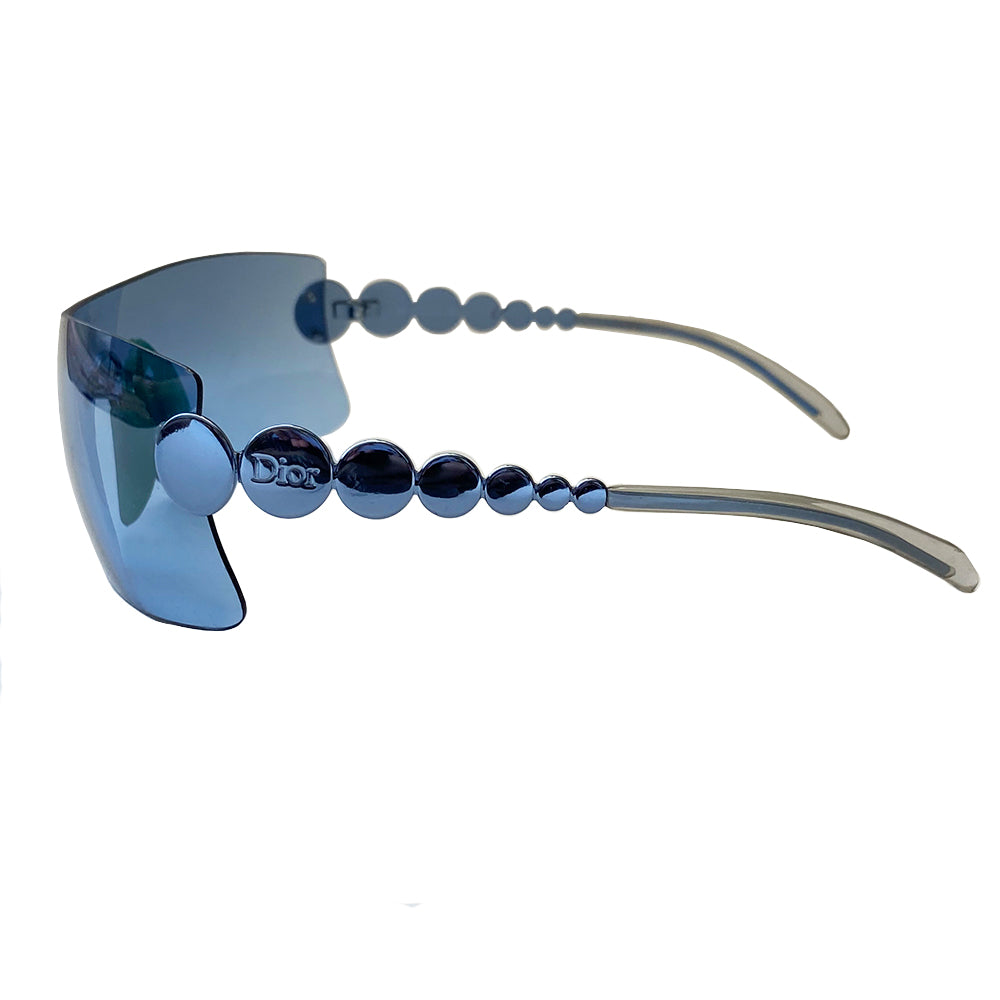 Christian Dior Millennium sunglasses from 2001. Oversized shield lens with silver-tone hardware Dior logo engraved on arms. Navy lens color with teal nose piece includes Dior pouch. 