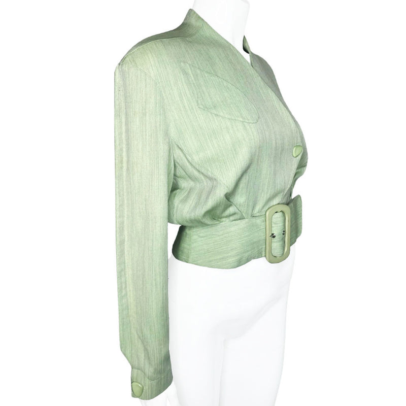 Thierry Mugler 1980's seafoam green wool jacket with angled front flap featuring the iconic Mugler wave, green acetate belt and triangle buttons. Three front snap closures, two at waist and one at chest, back pleats and blouson body. Made in France 