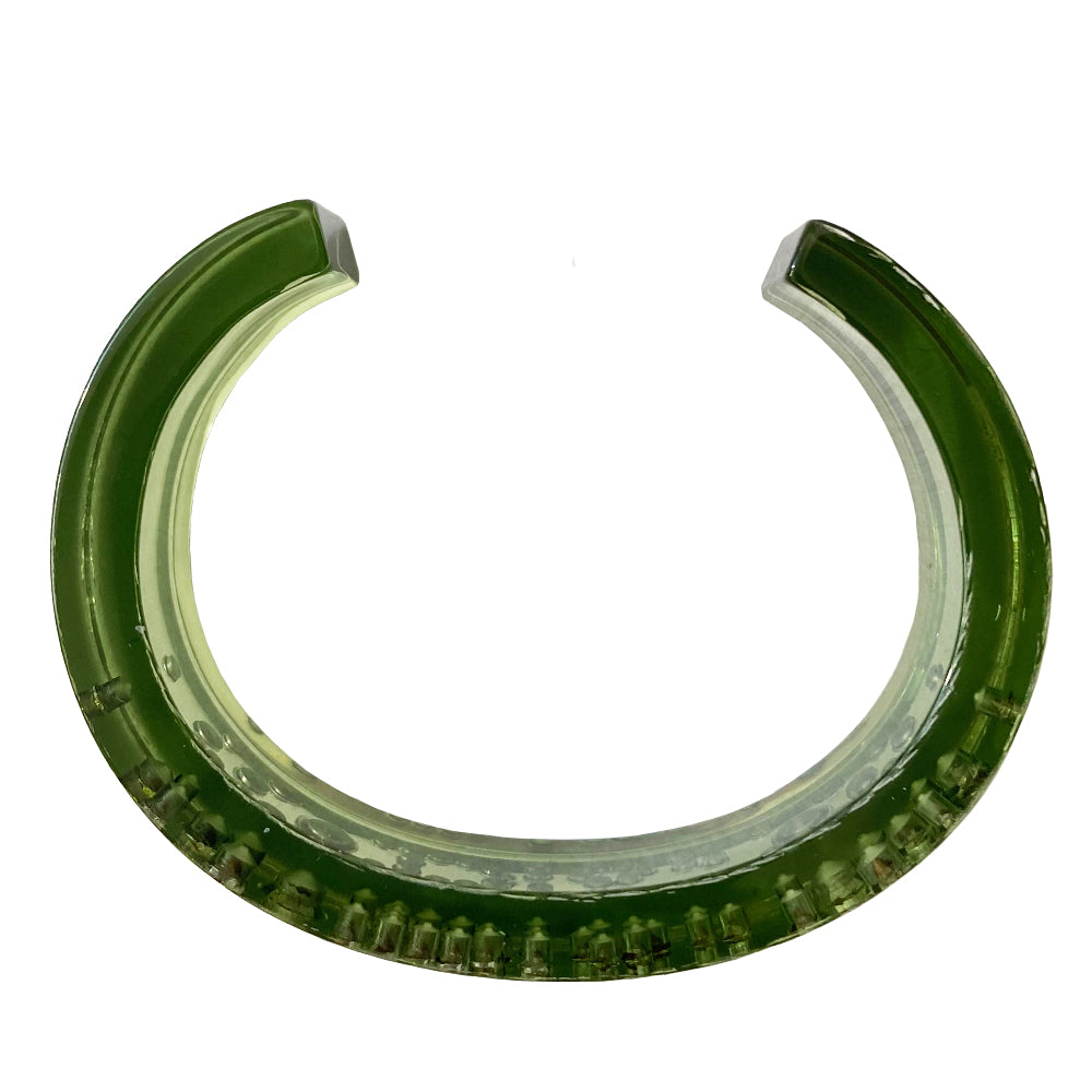 Christian Dior narrow green lucite crystal cuff with Dior spelled out in embedded brilliant green crystals. 