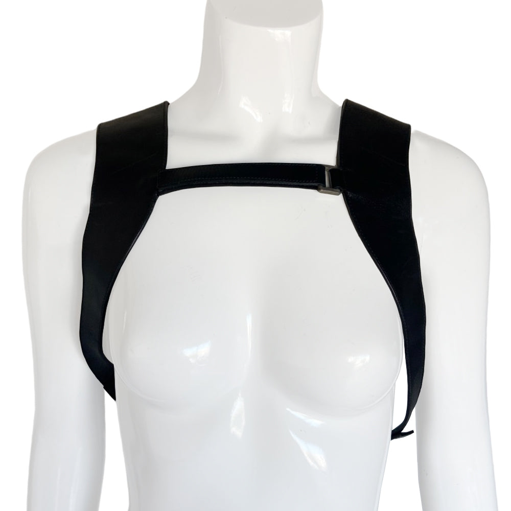 Prada spring 1999 RTW runway backpack in black and white tweed with black leather backing, adjustable leather harness straps, silver-tone hardware. Top zipper opens to jacquard logo textile lining with interior zip pocket. Made in Italy 