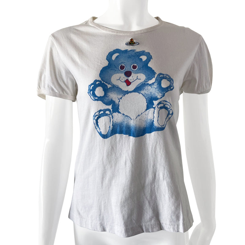 Vivienne Westwood teddy bear tee circa 1990’s Gold Label collection. Short sleeves with rounded neckline and side slits. Blue teddy bear printed at front center with floating embroidered signature logo orb. 