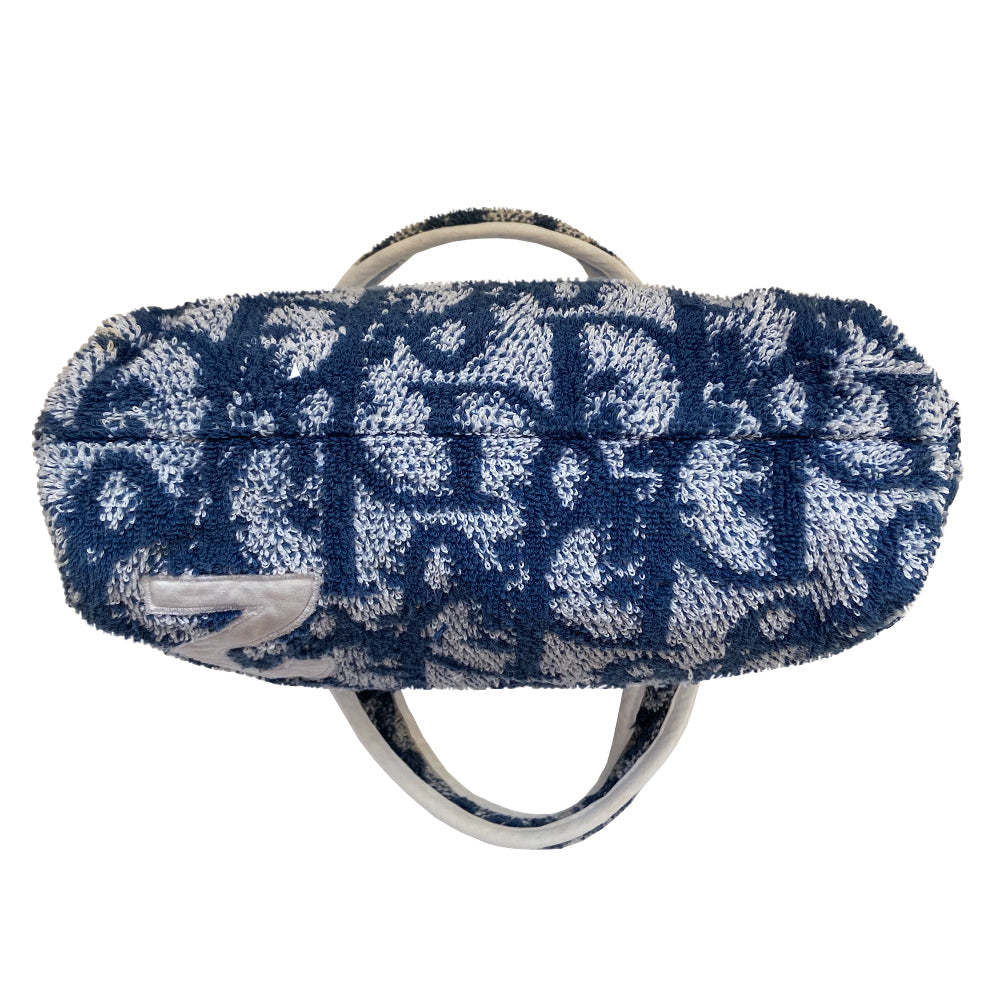 Christian Dior navy monogram mini terry fabric boston bag circa 2005 with No. 2 white appliqué in front, white piping on handles and at zipper, waterproof vinyl interior with 2 slip pockets, zipper closure, white textile ribbon zipper pull. 