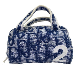 Christian Dior navy monogram mini terry fabric boston bag circa 2005 with No. 2 white appliqué in front, white piping on handles and at zipper, waterproof vinyl interior with 2 slip pockets, zipper closure, white textile ribbon zipper pull. 