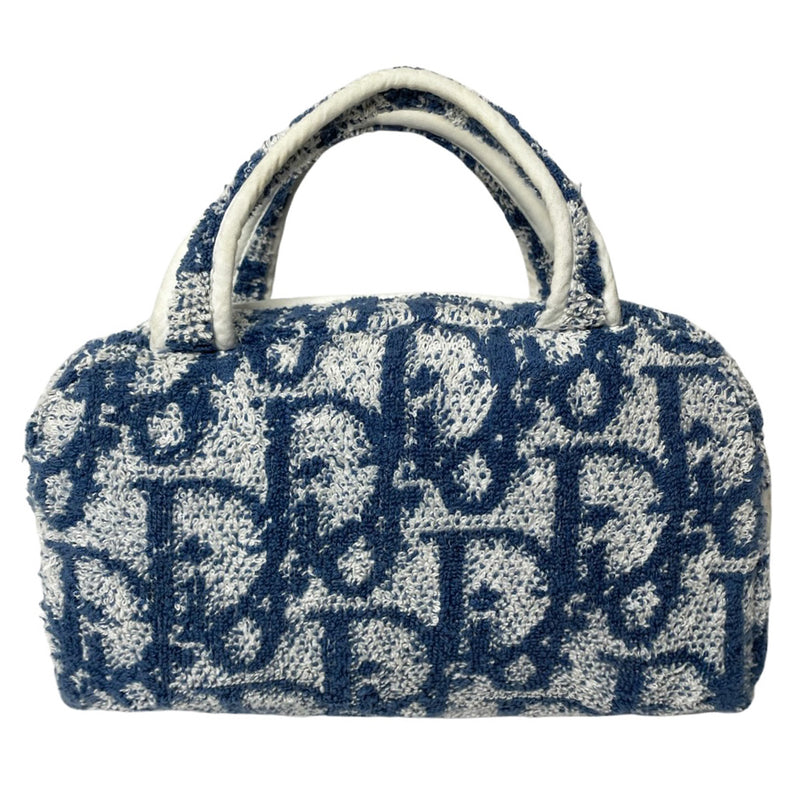 Christian Dior navy monogram terry towel mini boston bag circa 2005 with No. 2 white appliqué in front, white piping on handles and zipper. Waterproof vinyl interior with 2 slip pockets Zipper closure with white textile ribbon zipper pull. 