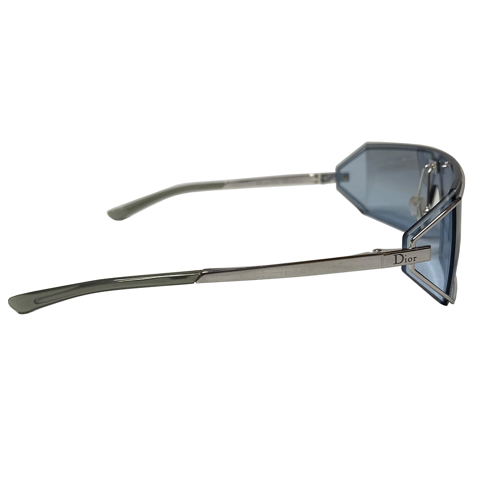 Christian Dior Troika blue lens sunglasses circa 1990’s. Futuristic rectangular shape silver-tone frame and lens that wrap around to the side with Dior engraved logo in center, silver-tone arms with engraved Dior logo at temple. Included: Box, case, soft case, cleaning cloth Condition: Made in Austria 