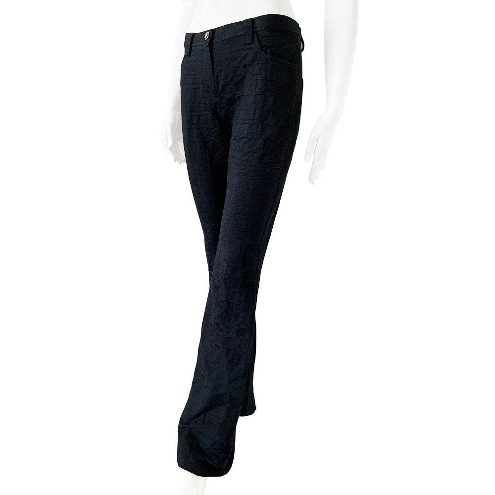 Versace raised all over Greek Key motif black trousers circa 1990’s. High waisted, flared leg with front zipper with silver-tone signature medusa head snap button closure. Front and rear pockets. Tag Size: IT 42 Made in Italy 