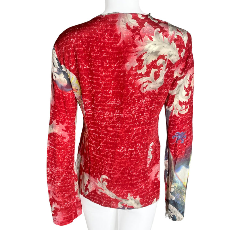 90's cult London label, Voyage long sleeve 100% silk unicorn print shirt featuring all over script print on arms and bell sleeves. Crossed lacing at front neckline, decorated with Swarovski embellished buttons around the collar. 
