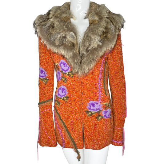 Circa 1990's from cult London label, Voyage. Orange knit body with purple and green rosebud woven print, lacing details at bell sleeves, front snap closure. Fully detachable silk lined fox fur collar. 
