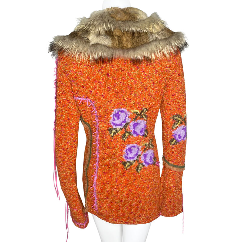 Circa 1990's from cult London label, Voyage. Orange knit body with purple and green rosebud woven print, lacing details at bell sleeves, front snap closure. Fully detachable silk lined fox fur collar. 