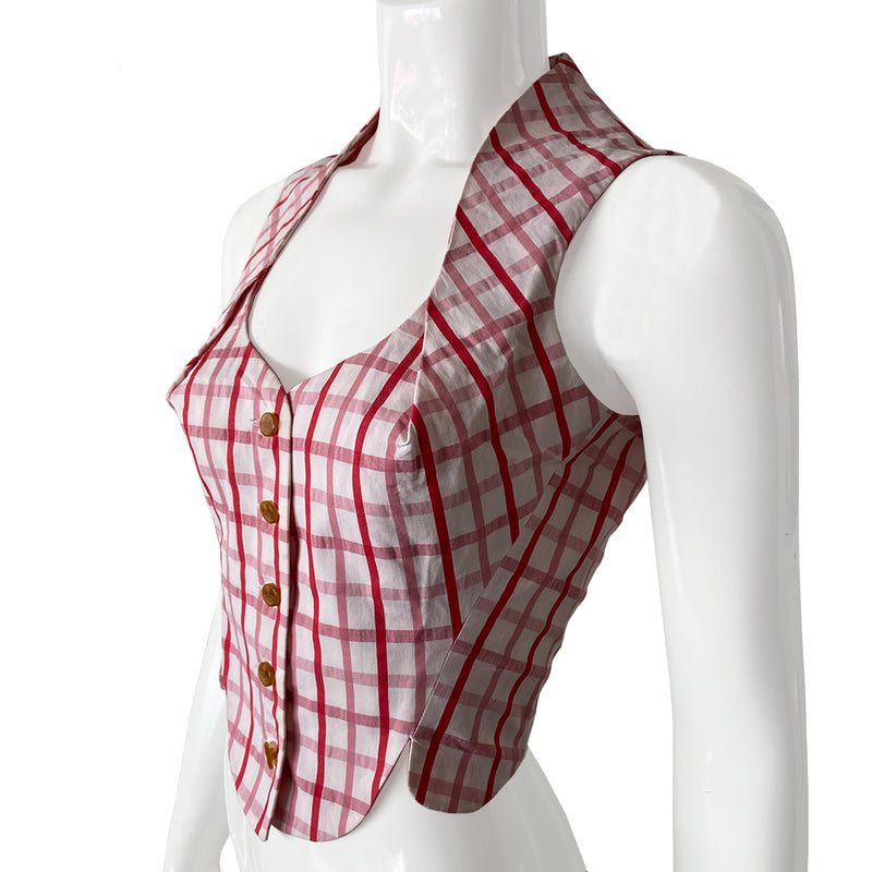 Vivienne Westwood 100% cotton sleeveless corset style check button up vest by Vivienne Westwood Red Label from 1991. Pink and white check scooped neck sleeveless short waisted top or vest with scalloped style hemline, angled front seams and pin tucking that accentuates bust line. Orb logo buttons front closure. 